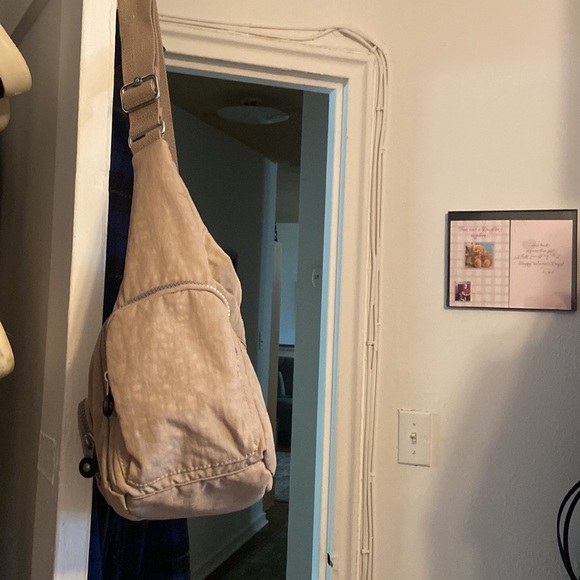 Kipling. 101/2 long x 9 high x 5 deep. New, no tags, beige. Perfect condition. - Picture 4 of 5